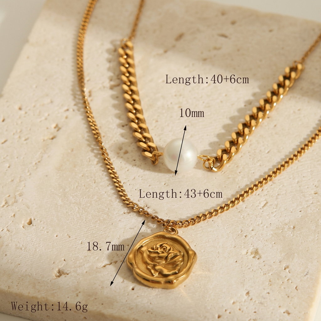 Close-up of Rosalie layered rose pendant necklace with chain lengths and dimensions on ivory limestone